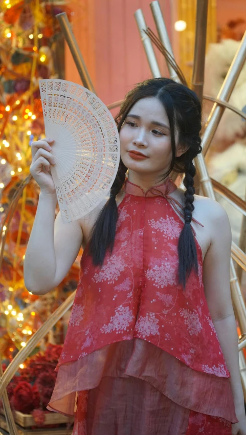 woman with white parasol in store window display