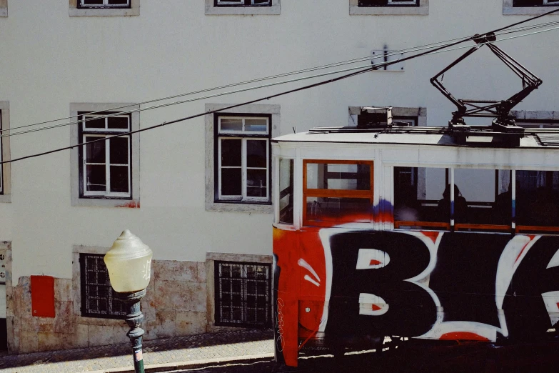 a large building with many windows and a cable car