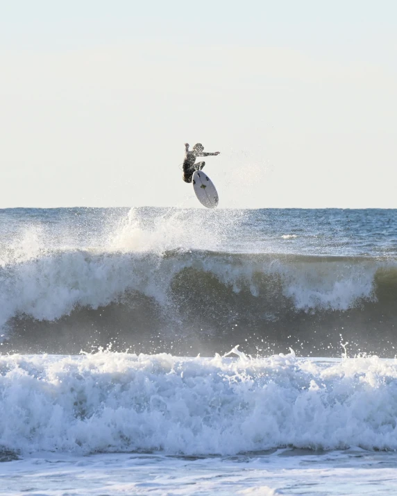 a person is kite surfing on some waves