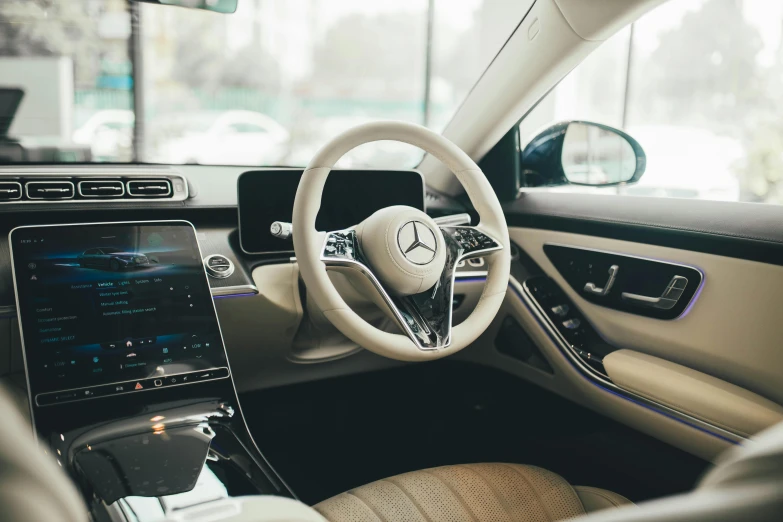 a view from the steering wheel inside a mercedes car
