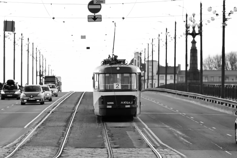 a trolley car on a busy street during the day