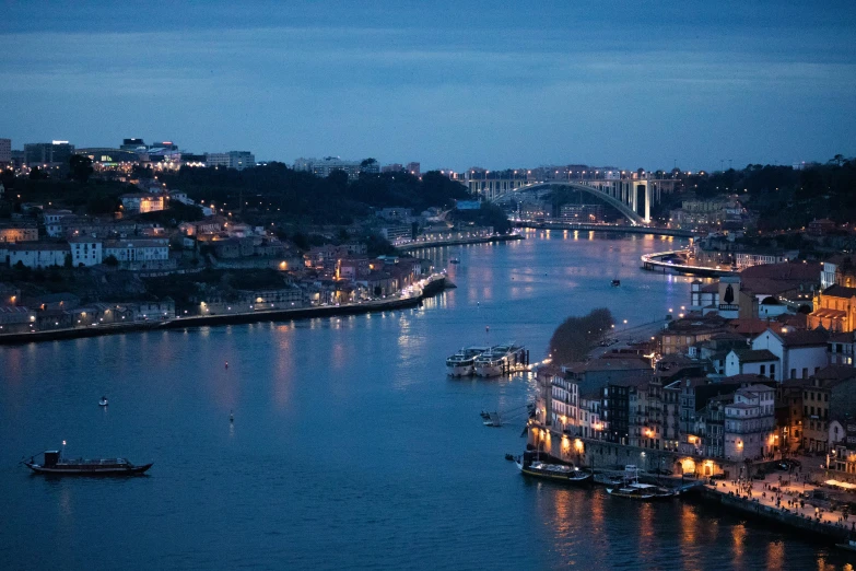 some boats on the water at night time