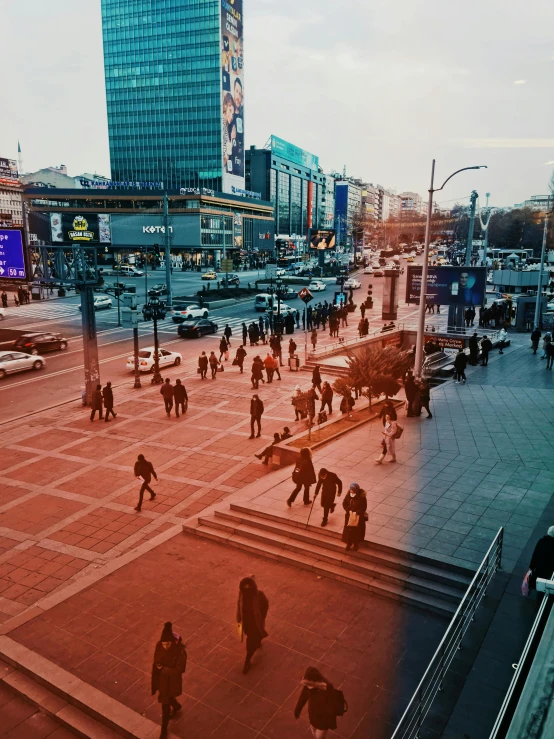 people on a sidewalk near the street outside of an airport