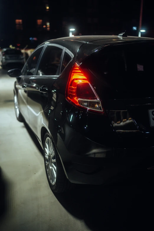 a car that is on the road at night