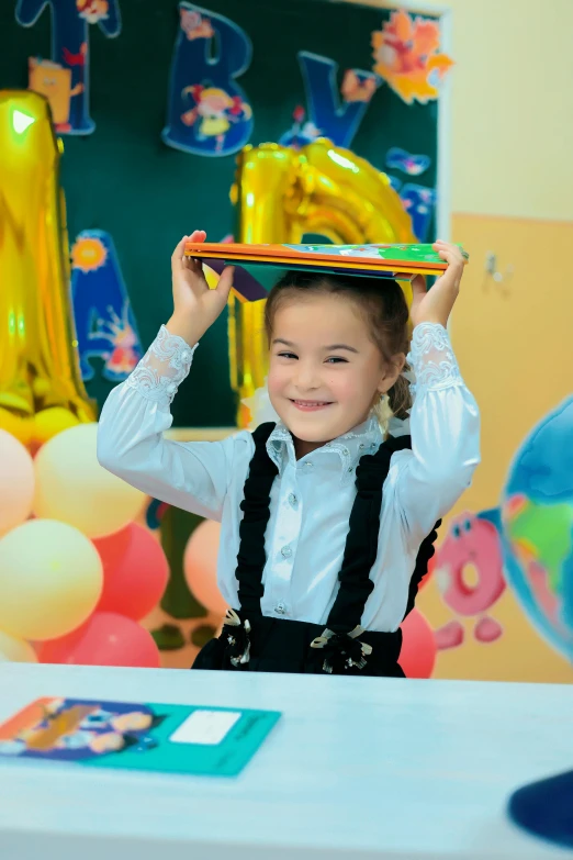 a  carrying a toy on her head