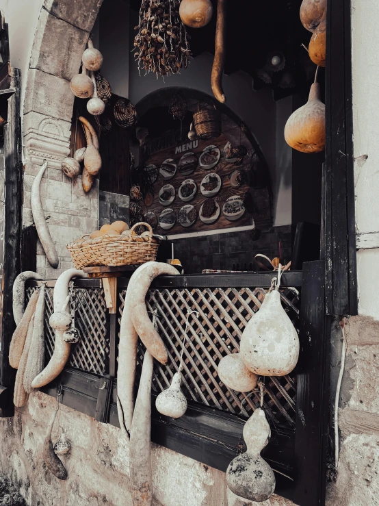 a building with ornaments inside of it, including baskets, clocks and lights