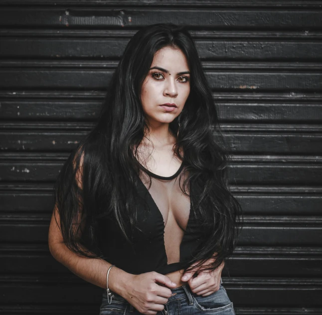 a woman posing in jeans for the camera