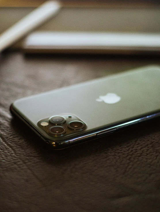 a picture of an apple phone on a table