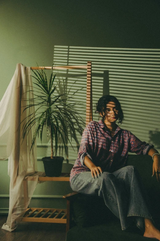 a young woman sitting in a room