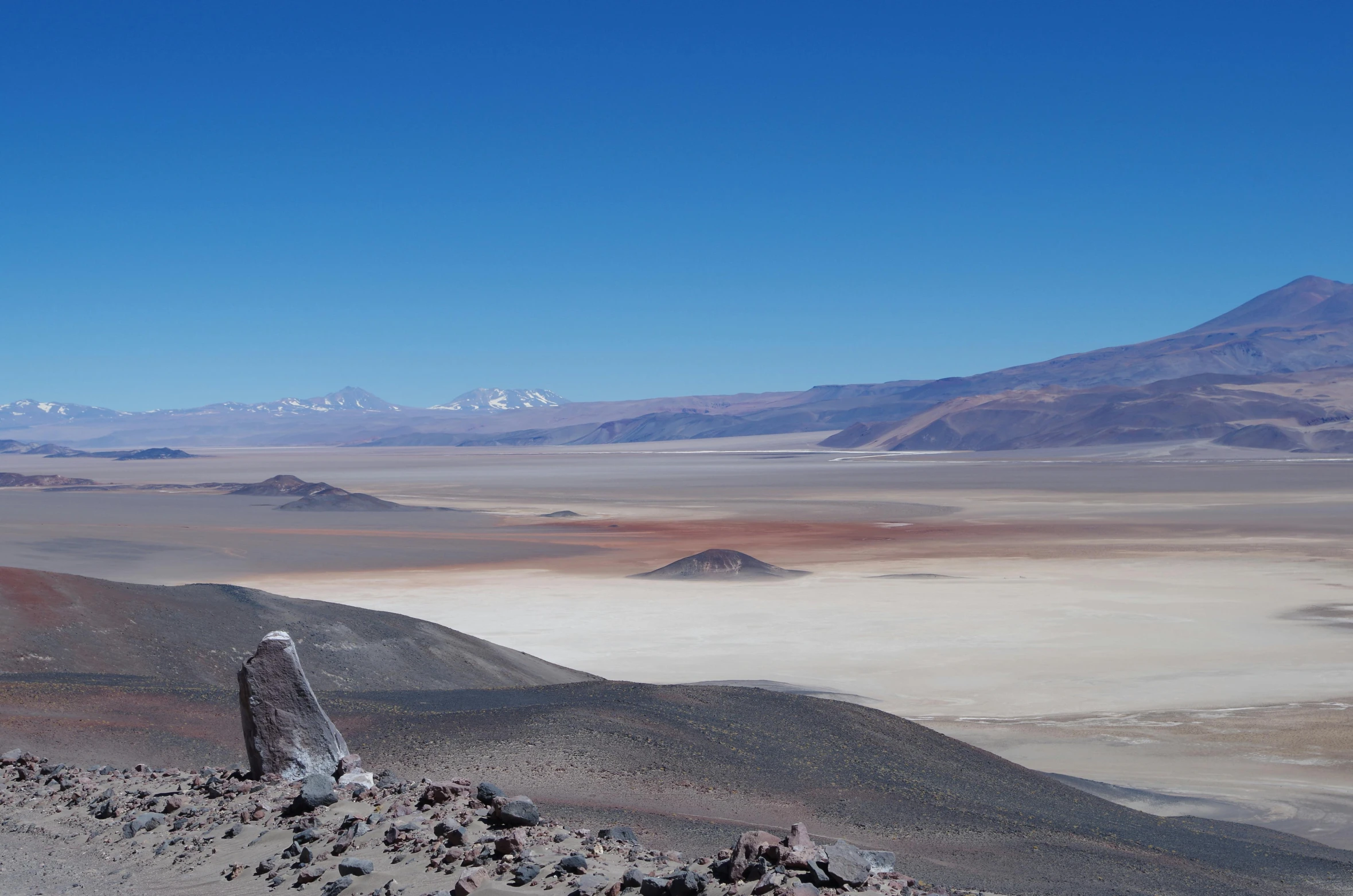 an arid landscape with mountains in the background