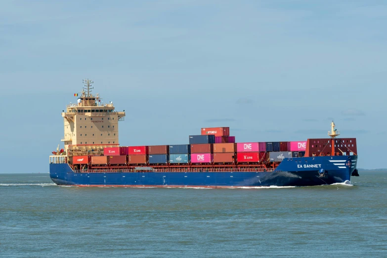 the big container ship is sailing through the open water