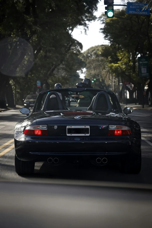 an image of two cars that are sitting in the road