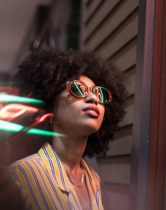 a woman is wearing sun glasses outside