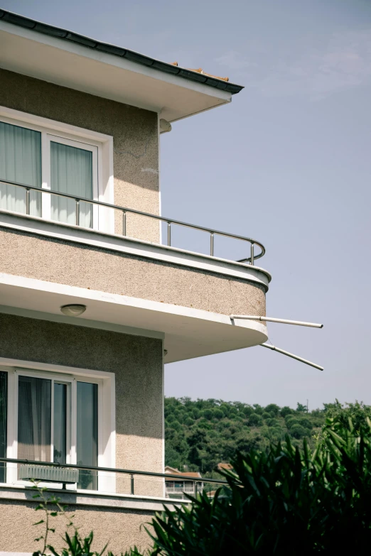 an open balcony on top of an apartment building