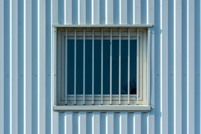 an image of a blue wall with a window