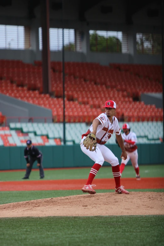 a baseball player that has just thrown a ball