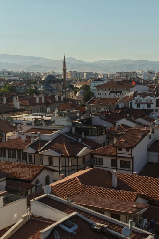 view of buildings in the city with hills in the background