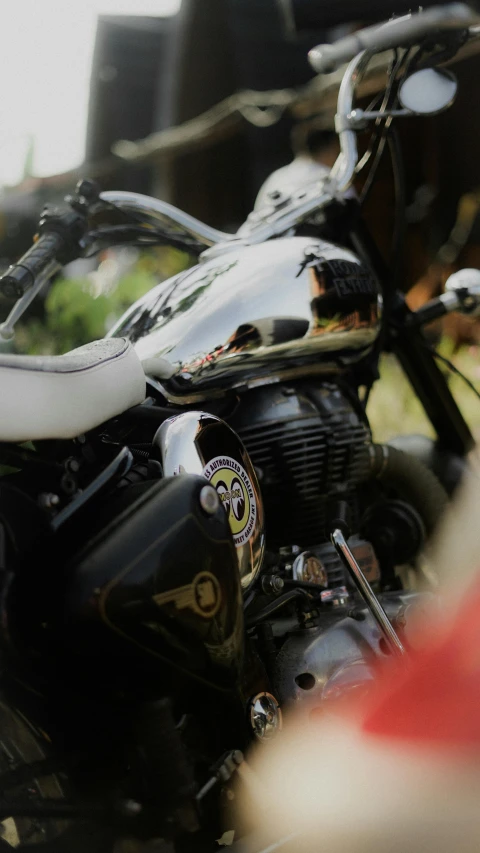 this motorcycle is parked on the ground at a show