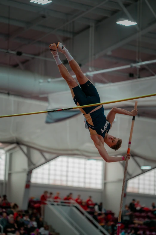 a person on the pole with a balance bar in front of them