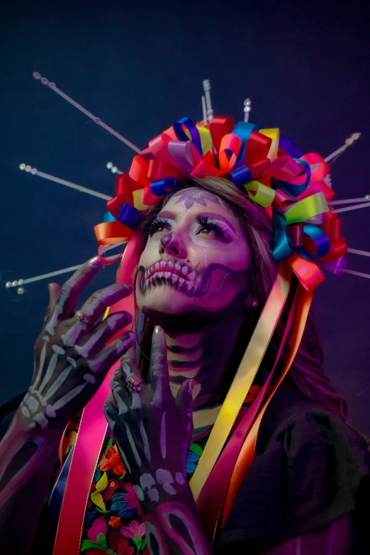 a woman with painted face and makeup on her face