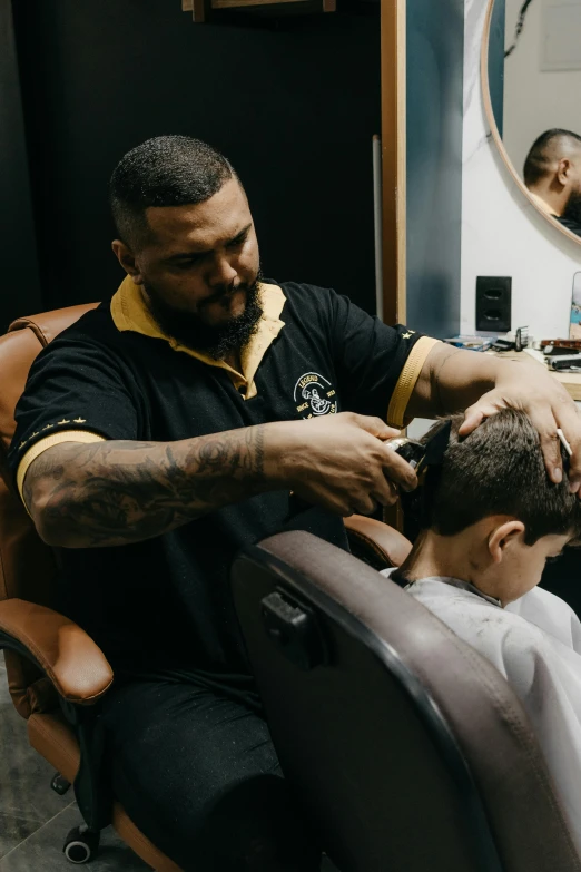 a man getting his hair cut from a barber