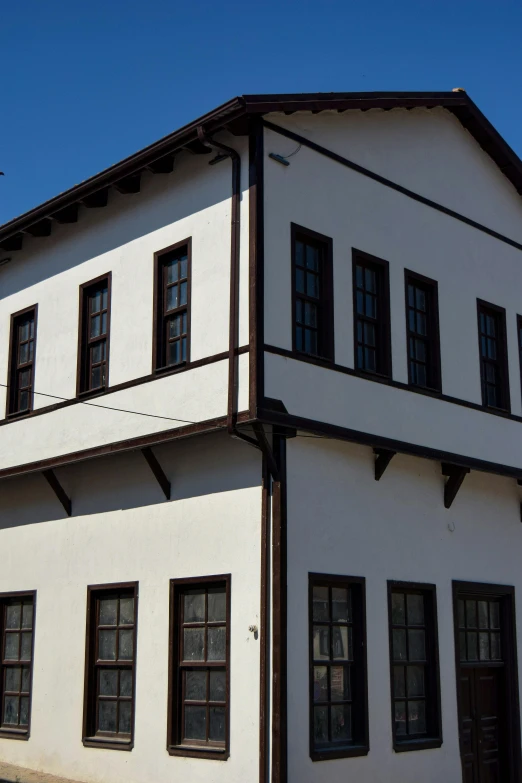 a white building with many windows on top of it