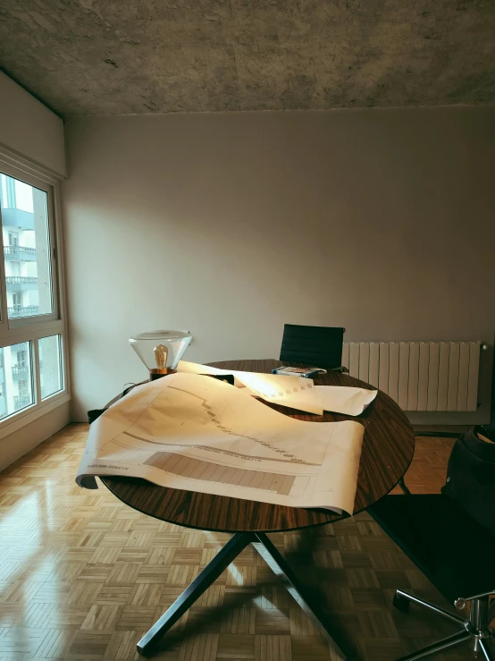 a table with a book inside of it in a room