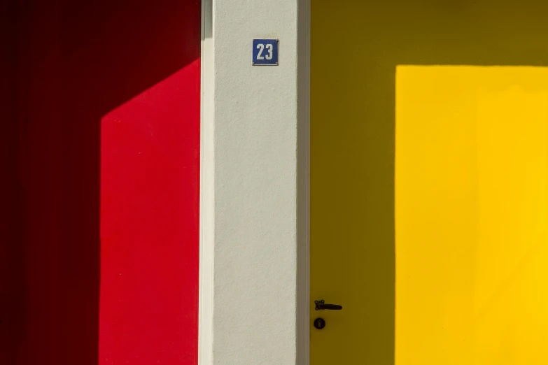 an opened door with red, yellow and blue painted on it