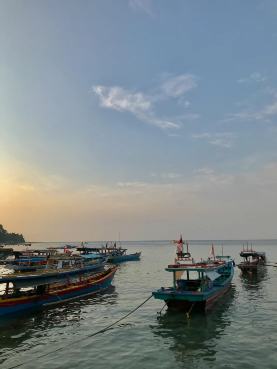 boats are on the shore by the ocean