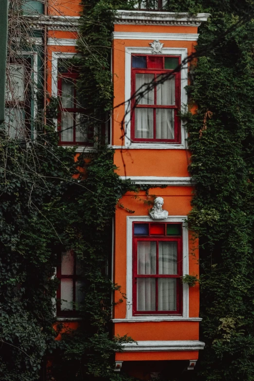 there is a tall building covered with many windows