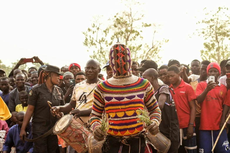 a group of people standing around each other