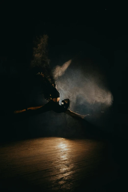 a person snow boarding at night with the moon in the background