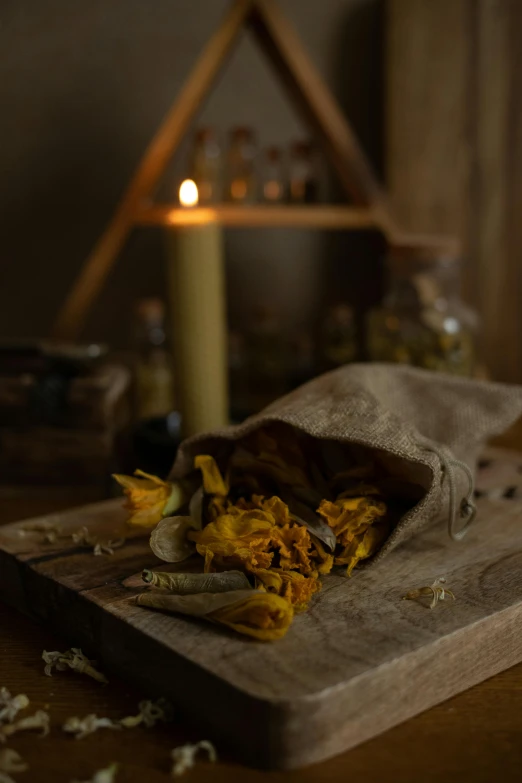 some yellow flowers spilled onto a brown board