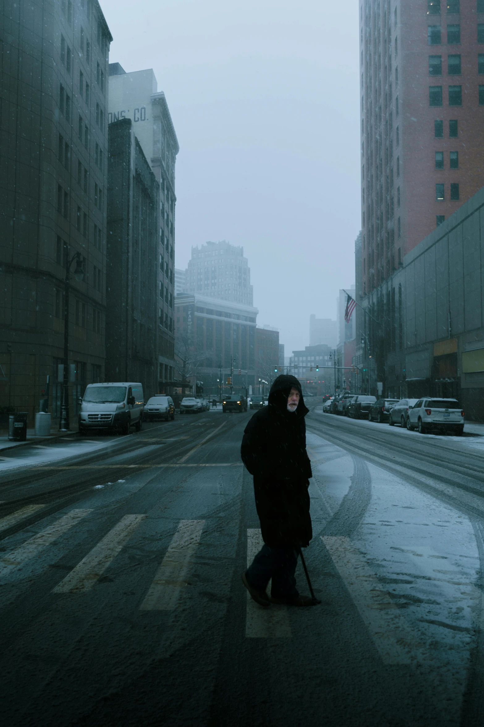 a person standing alone in the middle of a street