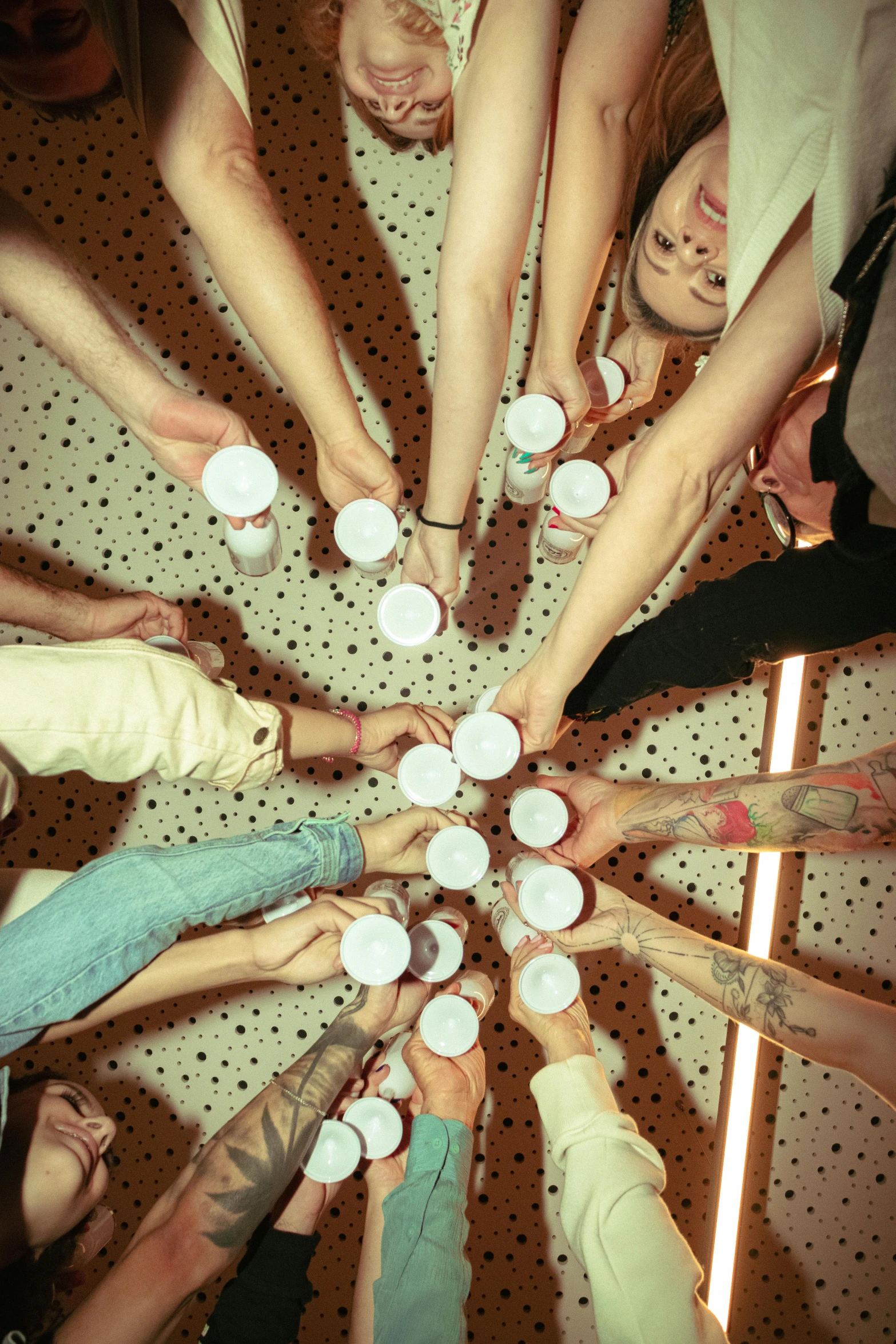 a group of people that are all holding their hands