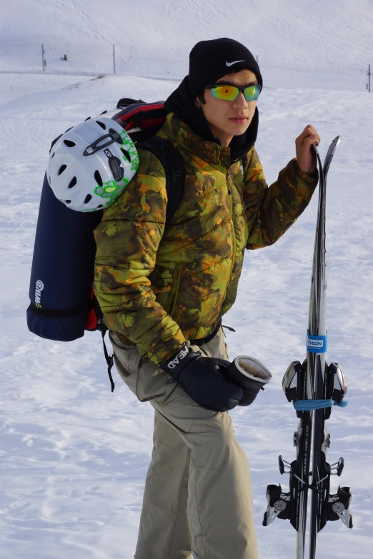 a person with some skis walking in the snow