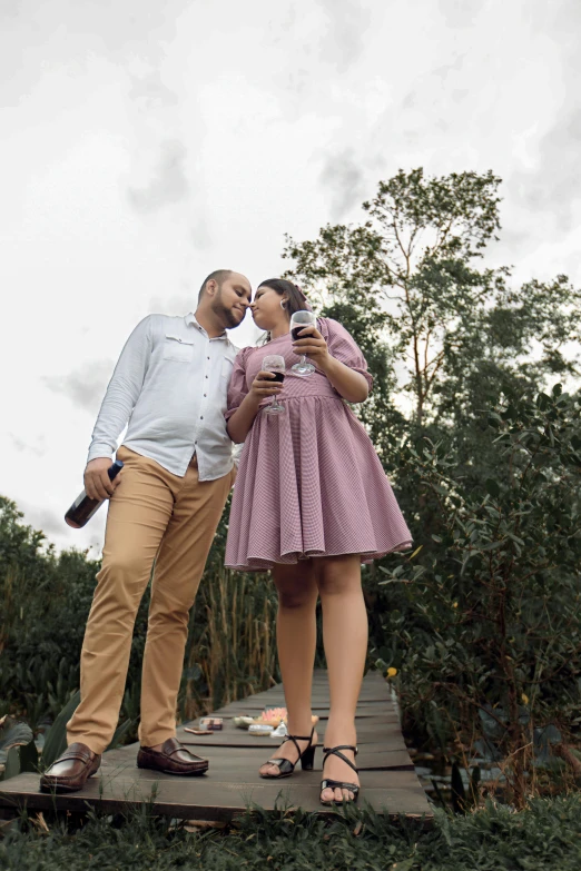 a couple standing together in front of the camera