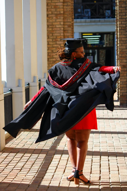 a woman is holding soing in her arms