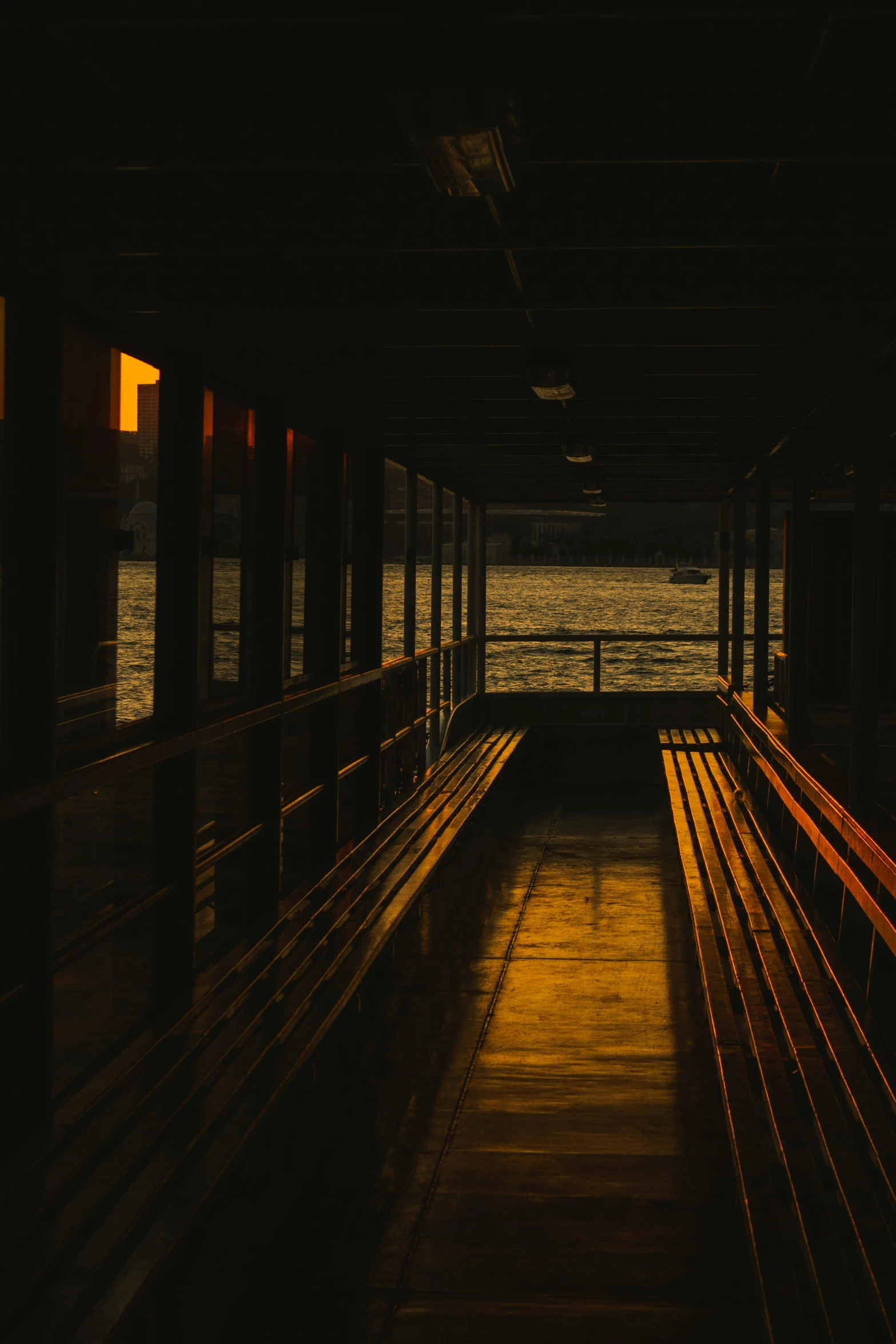 empty benches in the dark near water