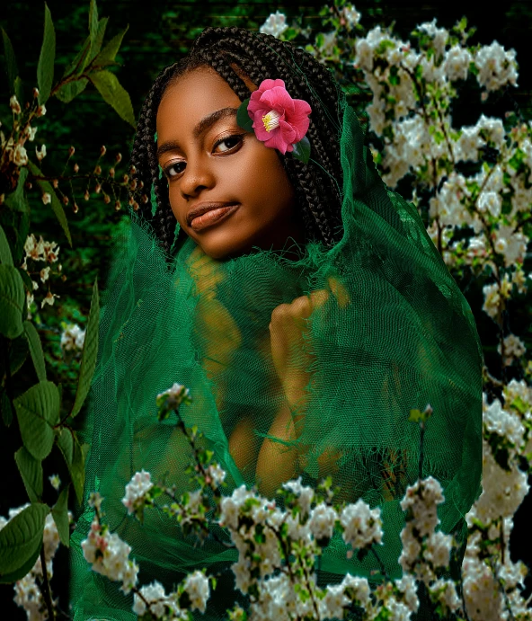 a woman with ids wearing a green shawl near flowers