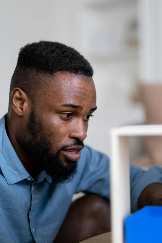 a man is looking at soing in a display