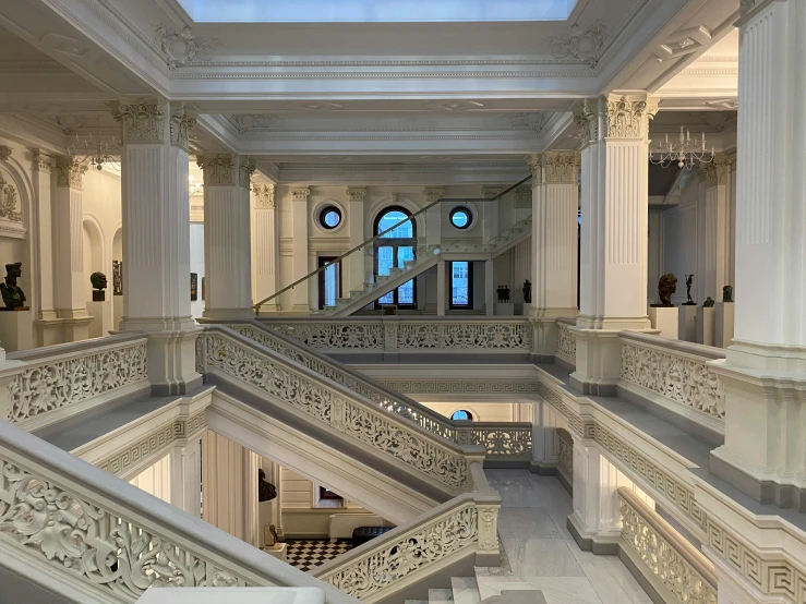 stairs lead up to the skylight at a large building