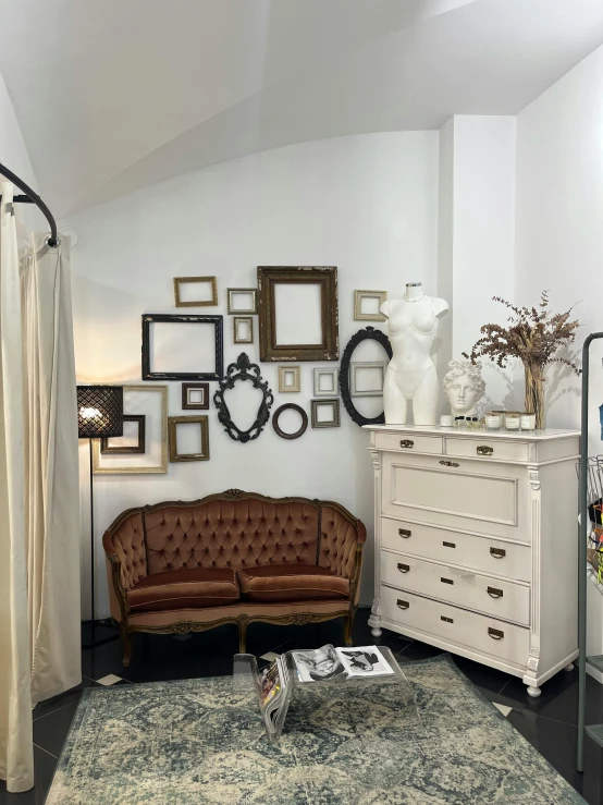 a living room filled with furniture and frames