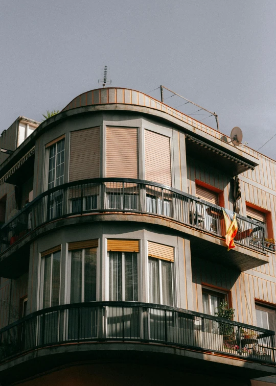 the balcony on a building is lined with windows