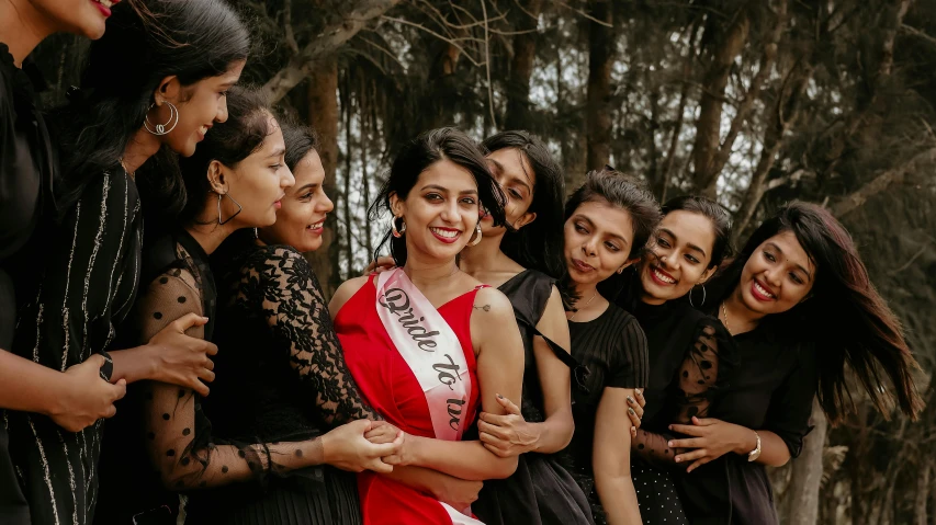 a group of women stand side by side posing together