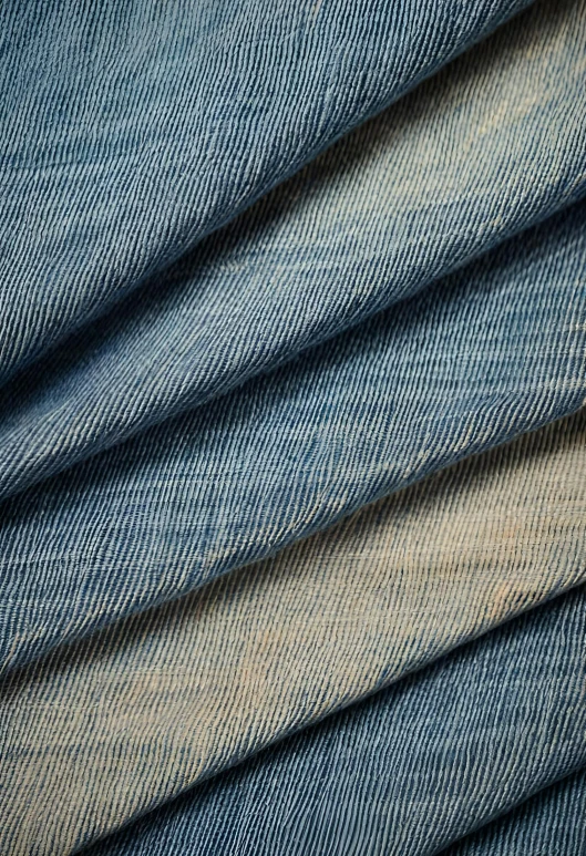 several layers of jeans folded together and laying in a circle