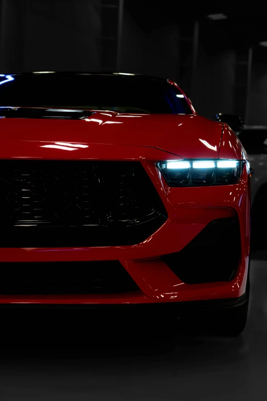 a red sports car in a dark building