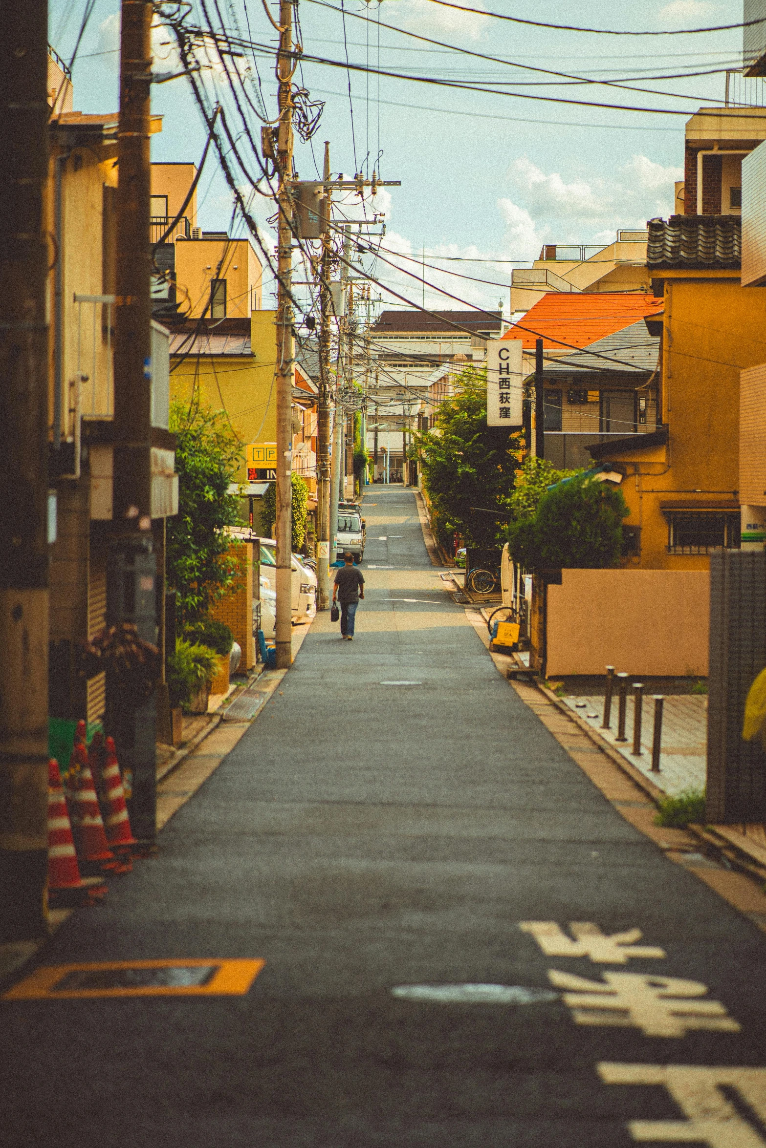 a man riding a bike down a long narrow road