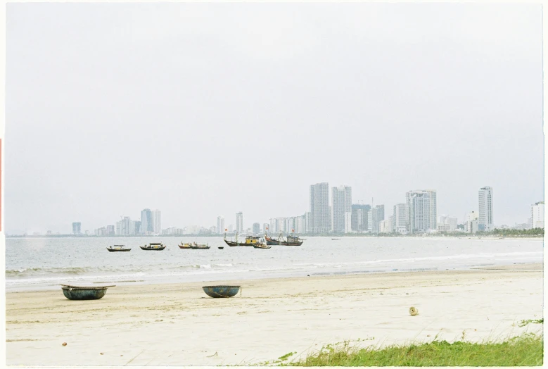 three boats floating on a large body of water