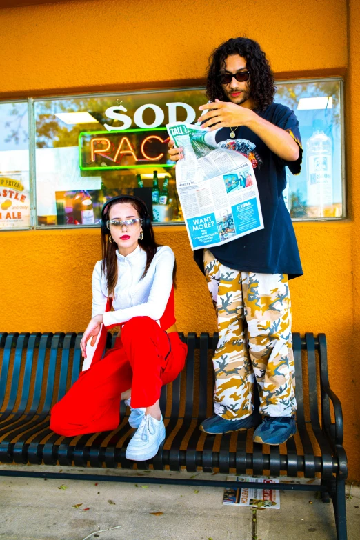 a woman is sitting on a bench with a boy